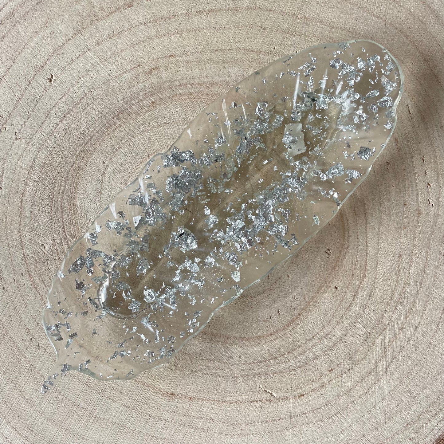 Vide poche plume argenté