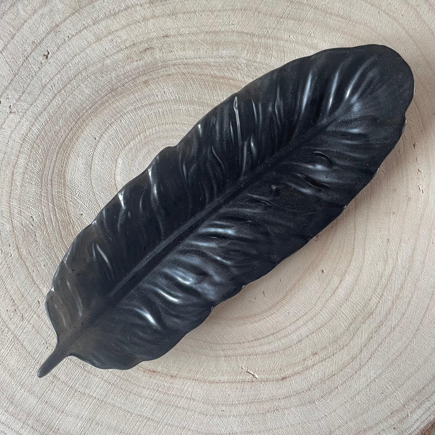 Vide poche plume noire